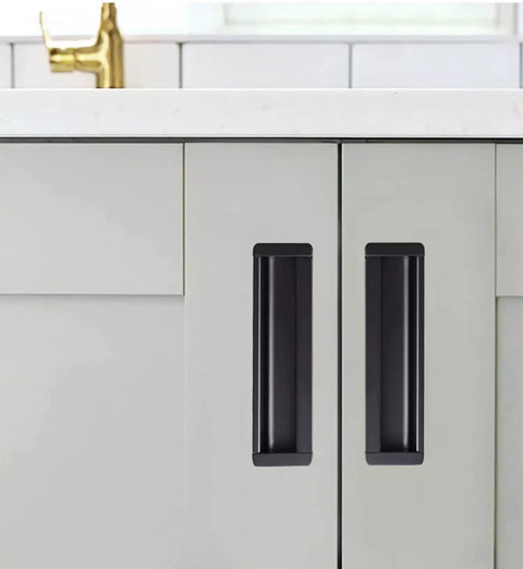 Hidden Black Drawer Pulls With Embedded Design For Sleek Cabinets shown on white cabinet doors