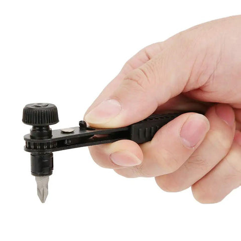 Premium 23Pcs Flexible Shaft Bit Set With Gold Plated Holder And Socket Kit For Electric Drill. Hand holding compact bit holder with screwdriver bit