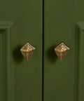 Antique Bronze Cabinet Knobs And Drawer Pulls Two Pack With Boho Geometric Silhouettes on green cupboard doors.