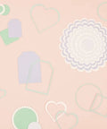 Mini Die Set For Scrapbooking And Card Making - 7 Scalloped Circle Dies, various cut shapes for DIY decorations on a peach surface.