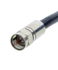 Close-up of a coaxial cable connector showing metallic threading, compatible with OmniSeal Pro XL Coax Compression Tool For F BNC RCA RG11F And MiniCoax Connectors
