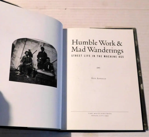 Open book showing title page of 'Work And Mad Wanderings Street Life In The Machine Age Photographic Social History By Ken Appollo'