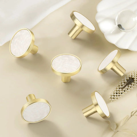 Gold and white round cabinet knobs on beige background, suitable for 12 Pack White Cabinet Knobs For Kitchen Cabinets And Dresser Drawers Drawer Pulls Easy Install Replacement Hardware Durable Smooth Finish Premium Quality Knobs For Home Renovation For Home Improvement
