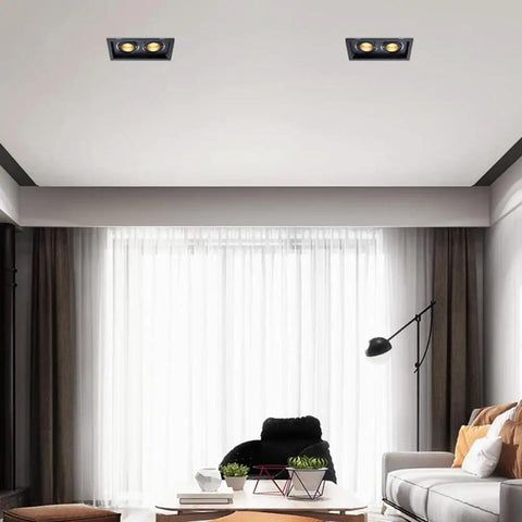 Upgrade Your Space Today With These Top Shelf Six Pack Adjustable Gimbal Eyeball Led Dimmable Canless Recessed Downlights Just Pop In The 14 Watt Dual Head Retrofit Kit For Instant Swivel Lighting That Slaps, showing two recessed lights in a modern living room.