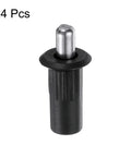 Close-up of a black plastic cabinet door repair pin from the 24 Pack Black Plastic Cabinet Door Repair Pins Heavy Duty Spring Loaded Damper Replacement Hardware For Kitchen Cabinets And Furniture Quick Snap No Fuss Axis Connector.