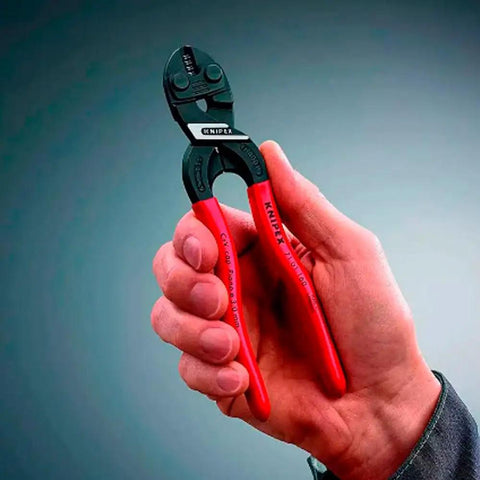 Hand holding CoBolt S Compact Bolt Cutters 160 mm with slim head, black coated, red handles