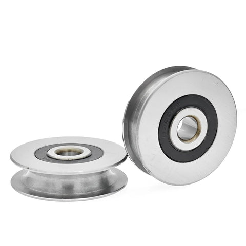 Two stainless steel deep U-groove ball bearing pulleys with 12 mm inner bore, 50x13 mm.