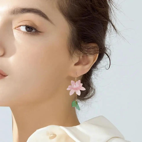 Woman wearing pink lotus earring from Dope Lotus Acrylic Beads Set, 24 Pieces In 7 Styles for DIY jewelry projects