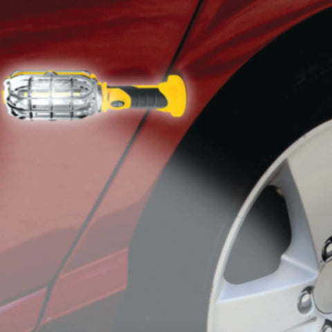 Ultra Bright Cordless LED Work Light With Magnetic Base 500 Lumens Battery Powered AA Batteries Included Handy On The Go Compact Handheld Flashlight attached to car with magnetic base, illuminating wheel area for repairs