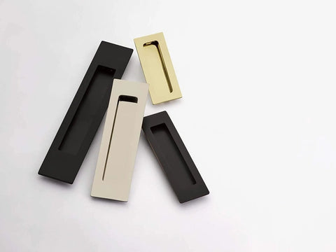 Modern Rectangular Flush Pull Handle In Flat Black Finish One And Three Quarters Inches Wide By Six Inches Long Sleek Minimalist Cabinet And Drawer Pull For Contemporary Kitchens And Bathrooms Durable Hardware With Hidden Mounting close-up view among other finishes