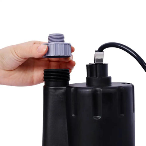 Hand removing the top cap of the Workhorse Submersible Water Pump One Third HP 2500GPH Thermoplastic Utility Sump.