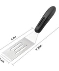 Mini stainless steel slotted spatula with black handle for flipping and serving in the kitchen