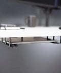 Universal Under Desk Laptop Mount With Adjustable Tablet Brackets For Hidden Computer Docking Station mounted under a white desk.