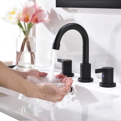 Person using Matte Black Bathroom Sink Faucet With Widespread 8 Inch 3 Hole Vanity Fit, 360 Degree Swivel Spout, Pop Up Drain Included