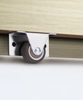 Side view of Four Pack Slim Side Mounted Flat Bottom Caster Wheels One And One Quarter Inch for furniture with steel bracket.