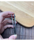 65mm Diamond Cutting Disc For Dry And Wet Grinding, Double Sided Saw Blade For Ceramic Tile And Granite, Diamond Grinding Plate, Pro Grade, Heavy Duty, Durable Grinder Tool For Smooth Flat Cuts, side view in hand