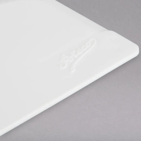 Close-up of a white polypropylene bowl scraper corner with embossed logo. Two Flexible Polypropylene Bowl Scrapers That Help You Get Every Last Drop Of Dough Batter Or Icing From Mixing Bowls And Flat Surfaces And Conform To Curves For Mess Free Scraping.