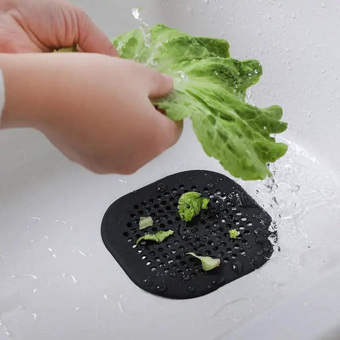 Person rinsing lettuce over Real Deal Silicone Drain Hair Catcher 2 Pack With Grip Secure Suction Cups For Shower Sink Strainer Reusable Bathroom Tub Hair Filter Easy Lift Design Keeps Drains Clear Zero Fuss.