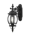 Frontenac 1 Light Outdoor Wall Lantern with clear beveled glass shades, black finish, side view of intricate scroll design, 20 inch
