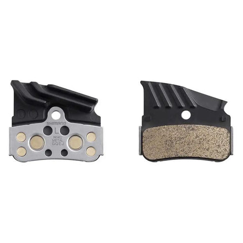 N04C Metallic Brake Pads For XTR XT SLX Four-Piston Disc Brakes, showing front and rear views, metallic texture visible.