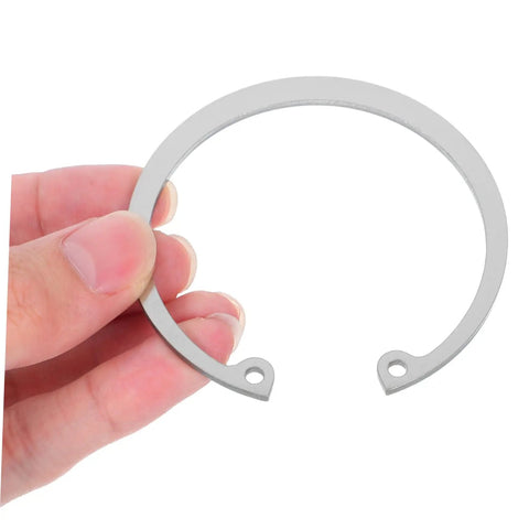 Hand holding Stainless Steel Snap Ring Kit Five Piece C Clips Circlips Retaining Rings for Shafts Pins and Studs, Rust Resistant