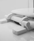 Close-up of white plastic toilet seat hinge replacement with bolts and nuts durable construction easy install for standard toilets