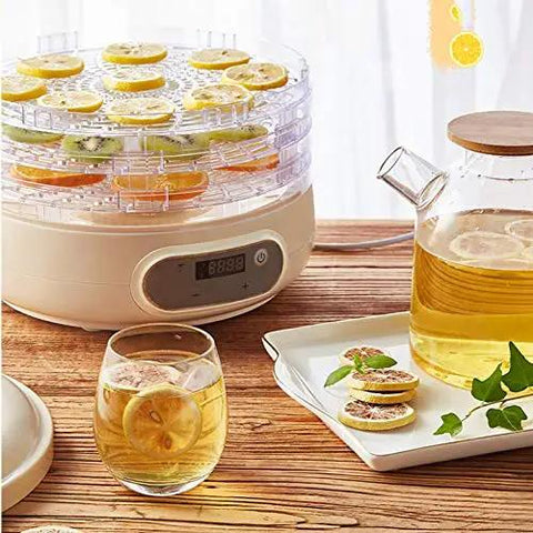Compact Electric Food Dehydrator Machine For Fruit Jerky And Herbs With Five Stackable Trays Digital Timer Precise Temperature Dial No Fuss Setup Kitchen Game Changer with dried fruits and herbal tea.