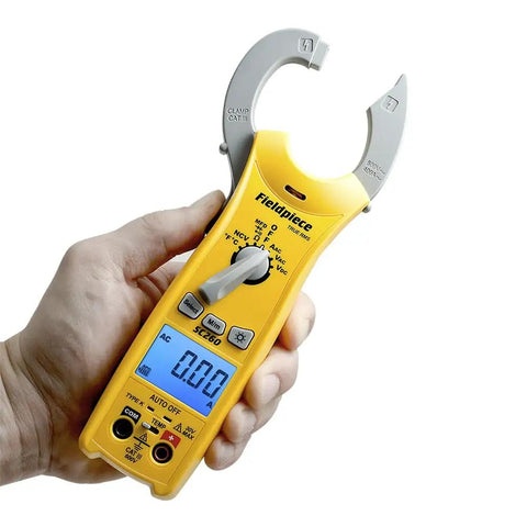 Person holding Compact HVACR Clamp Meter With True RMS Temperature Capacitance And Backlight For Field Service Go To Pro Grade Build