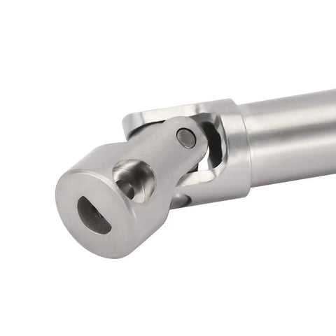 Close-up of stainless steel drive shaft with D-shaped hole for SCX24 Deadbolt GX470 transmission and axle connection.