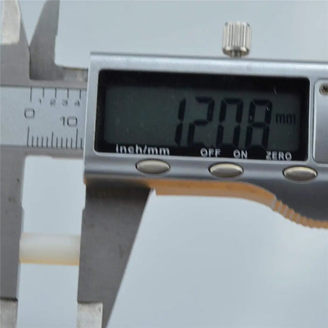 Digital caliper measuring 12.08mm showing precision measurement for Real Deal White Nylon Hex Standoff 100 Pack M3x12mm.