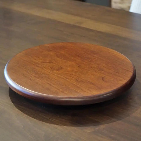 12 Inch Solid Cherry Wood Lazy Susan 360 Degree Turntable For Kitchen And Dining Countertop on a dark wooden table