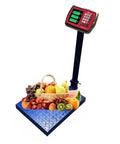 Heavy Duty Foldable Digital Floor Scale Delivering Straight Shooter Accuracy HD LCD Display And No Hassle Rechargeable Power For Luggage And Parcel Weighing Up To Six Sixty Pounds with fruits on measuring plate.
