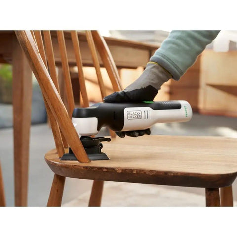 Eco Friendly Cordless Oscillating Multi Tool With 12V Max Muscle And Rapid Blade Swap Mechanism cutting wood on a chair.