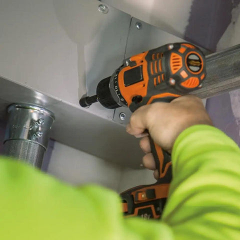 Person using Pro Impact Driver Bit Set 5/16 Inch Hex Nut Driver Long Reach 3 Pack S2 Impact Rated Steel in electrical panel.