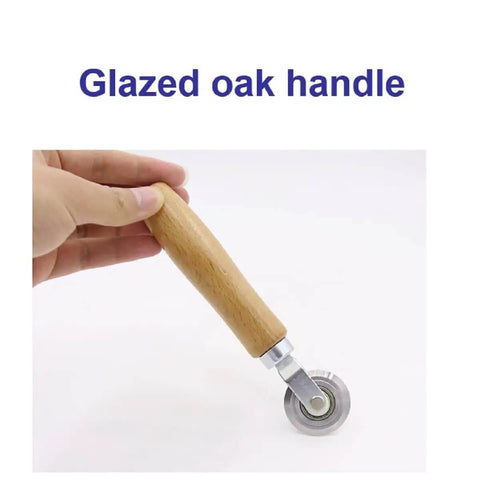 Close-up of Precise 0.5mm Cardboard Scoring Tool with glazed oak handle and durable metal wheel