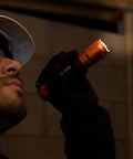 Person using Rechargeable 3 In 1 LED Flashlight With Spotlight Floodlight And Red LEDs 1000 Lumens USB Cable Included for inspection