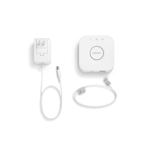Hue Bridge Smart Lighting Hub For Hue System Unlock Full Automations Multi Room Control Zones Remote Access From Anywhere Voice Control Zigbee Secure Connection Matter Compatible shown with included cables on white background.
