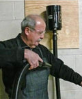 Man using Industrial Air Blaster For Quick Kickin It Clean Cleanup Of Clothes Surfaces Electronics And Car Interiors With High Volume