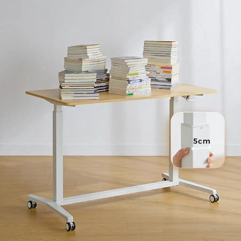 Electric Sit Stand Desk Offering Smooth Height Adjustment, Mobile Rolling Computer Workstation For Home Office with stacked books.