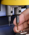 Close-up of Five Piece 2.5mm Milling Cutter Set for Key Cutting Machines in use, showing precise lock key cutting process.