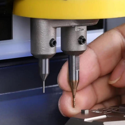 Close-up of Five Piece 2.5mm Milling Cutter Set for Key Cutting Machines in use, showing precise lock key cutting process.