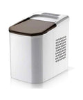 Hassle Free Portable Electric Countertop Ice Maker Drops Twenty Six Pounds Of Crisp Cubes Fast With Ultra Quiet Operation and Clear Sight Window for Home Bars and Offices, side view.