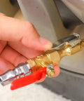 Hand holding a heavy duty metal Straight Up Slick Lock On Tire Inflator Chuck with red quick release valve for vehicle tire inflation.