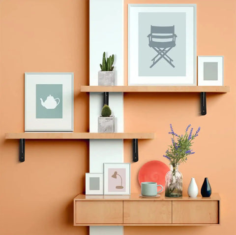 Legit Heavy Duty Folding Shelf Brackets Solid Steel Wall Mounted Space Saver with shelves displaying decor and plants.
