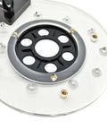 Universal Offset Router Base Plate For Precision Woodworking clear acrylic foot with black center and mounting holes for routers.