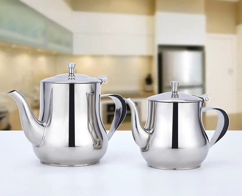 Two stainless steel teapots on a kitchen counter, including a Mini 360Ml Stainless Steel Teapot For Tea And More, Ultra Compact Yet Sturdy.
