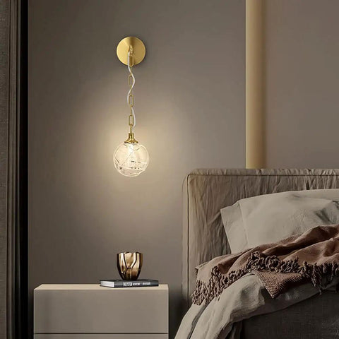 Top Shelf High Quality Brushed Brass Wall Sconce Paired With Frosted Glass Globe Led Bathroom And Bedroom Vanity Light Adjust Your Space With This Durable Fixture on a beige wall.
