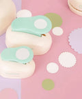 3 Inch Circle Scallop Punch with Easy Lever Press for scrapbooking, DIY cards and journals, shown with cutouts and punch tools on desk