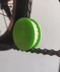 Two Pack Portable Bike Chain Oiler Roller Lubricator Round Lubricant Applicator Green in use on bike chain
