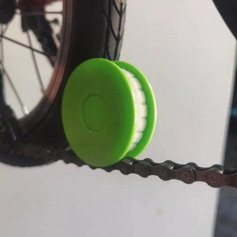 Two Pack Portable Bike Chain Oiler Roller Lubricator Round Lubricant Applicator Green in use on bike chain